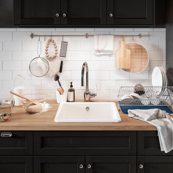 KUNGSFORS metal bars on otp on kitchen sinks with hooks.
