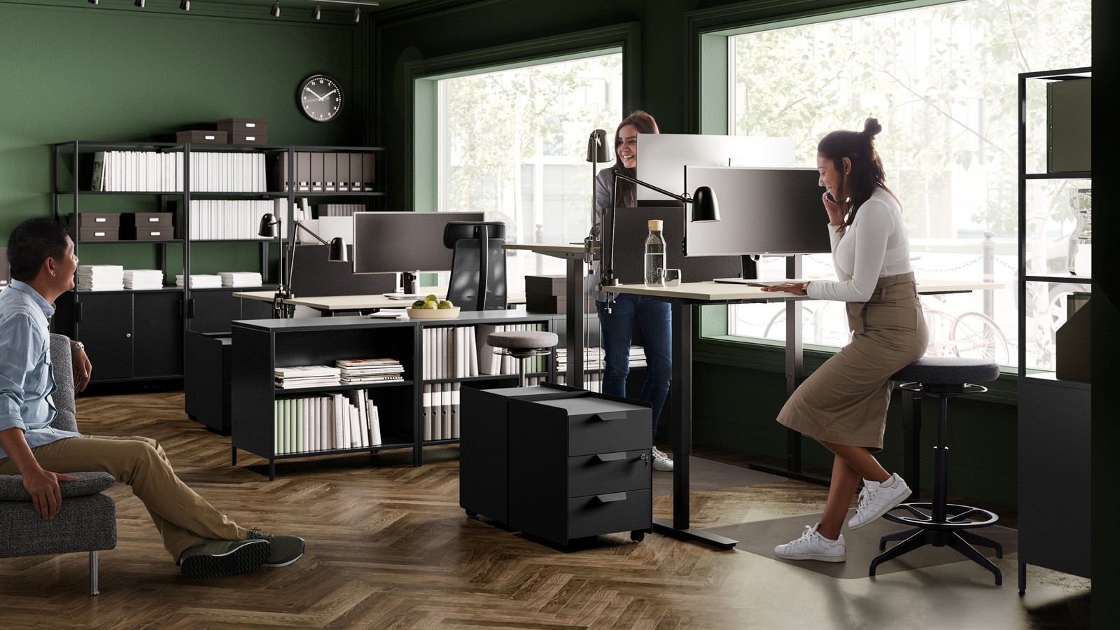 A beige sit-stand table top in a bright workspace
