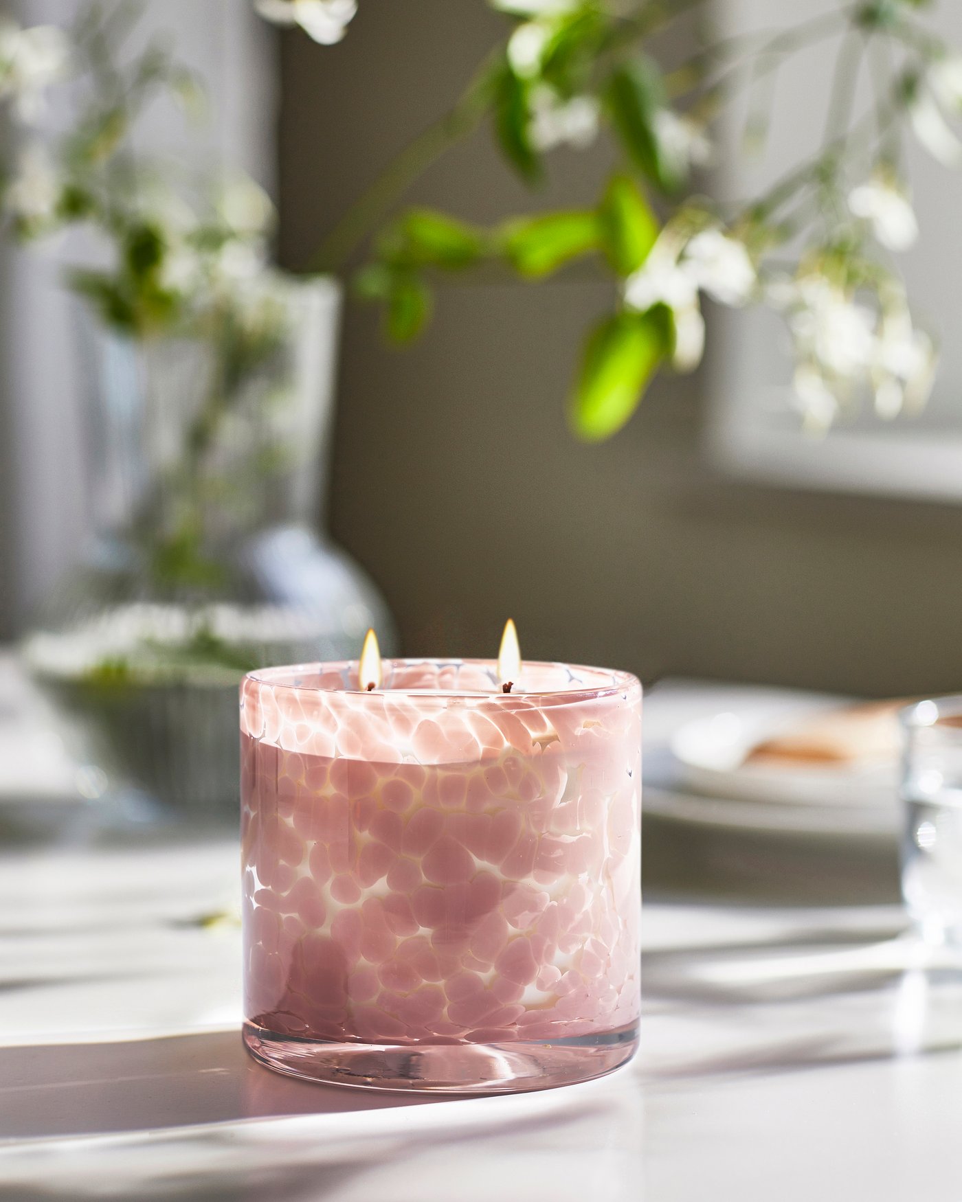 A Jasmine/light pink LUGNARE scented candle in glass, 2 wicks