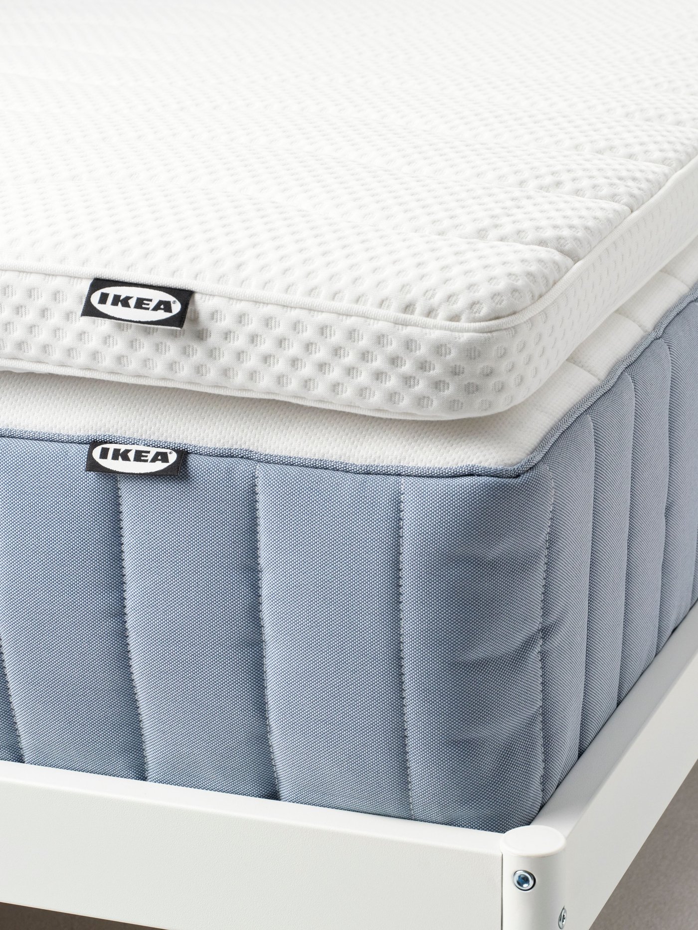 A white NORRSELE mattress pad