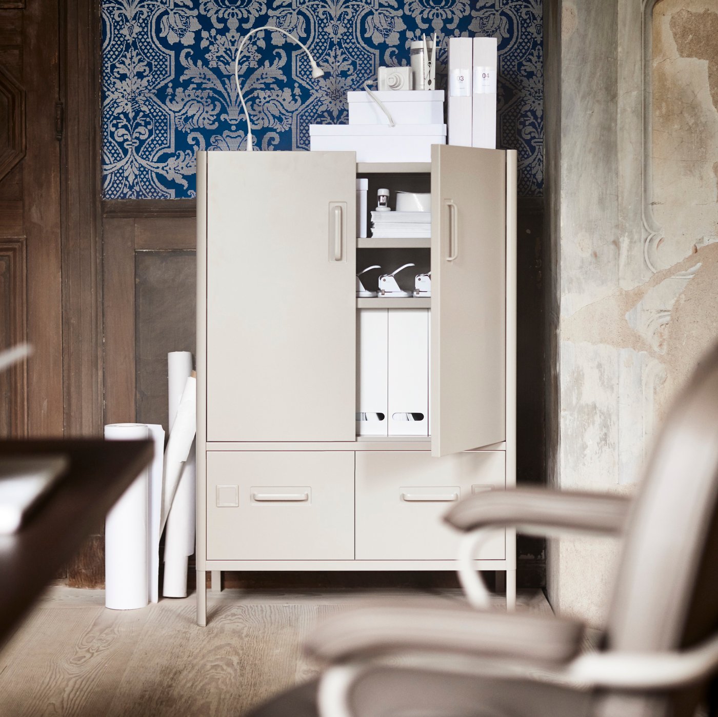 An IDÅSEN office cabinet with doors and drawers in beige