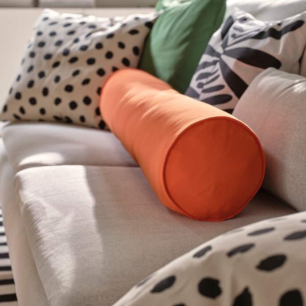 An off-white/black MAJSMOTT cushion cover in the living room