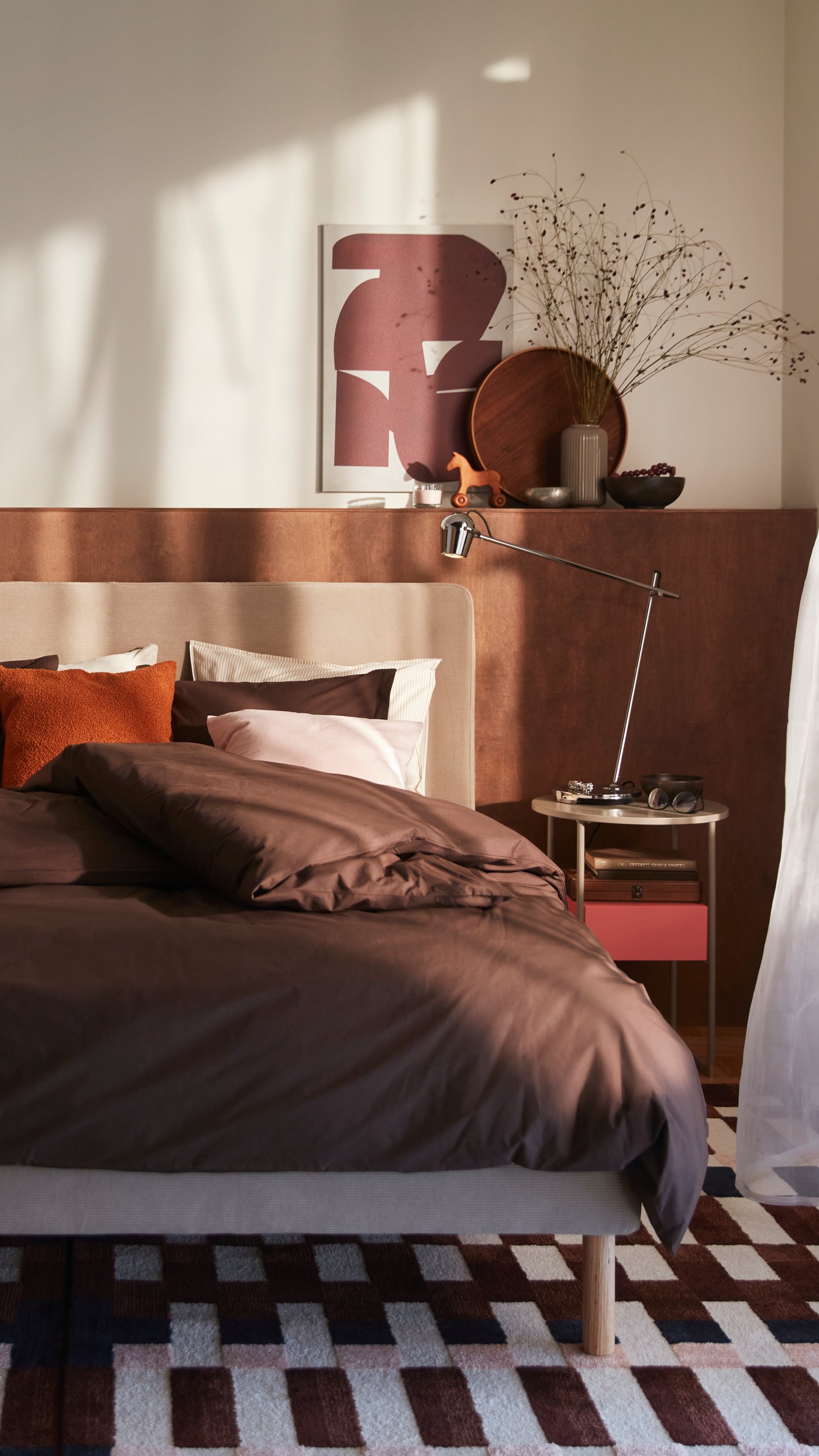 A chrome-plated MODERMOLN work lamp in the bedroom