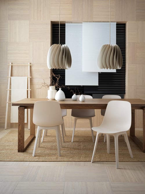 Dining area with dining table, chairs, pendant lamp, vases, block-out blinds, towel stand, flatwoven rug, cellular blind.