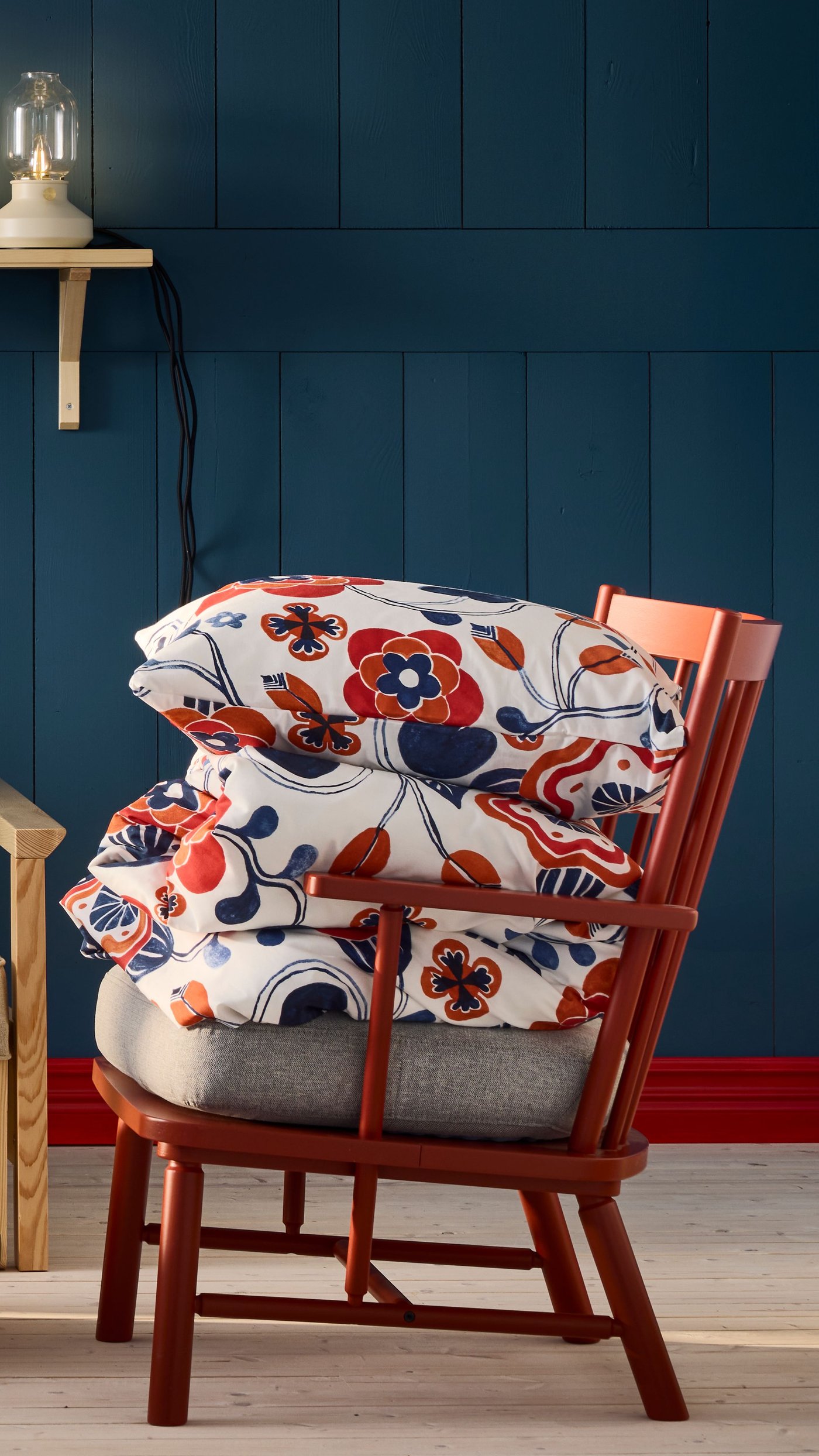 A white multicolour/floral pattern KANONVISKA duvet cover and pillowcase in the living room