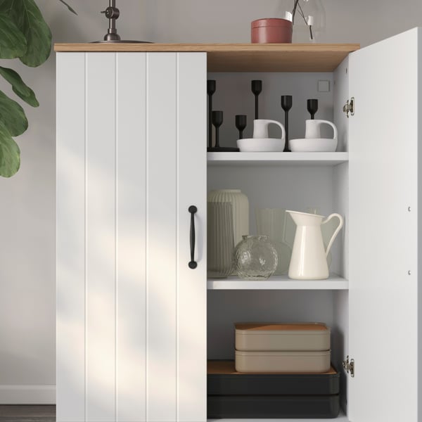 A white SKRUVBY cabinet with doors