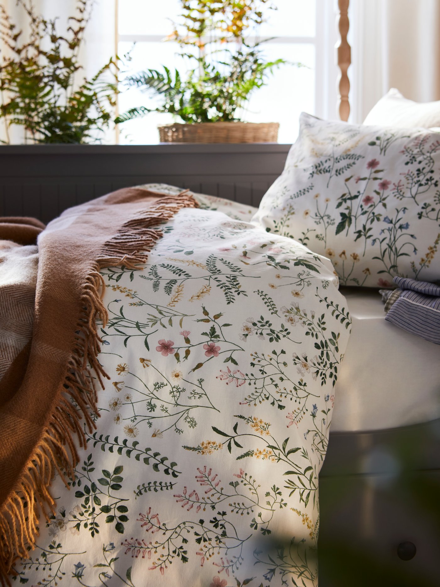 A light brown MYRULL throw