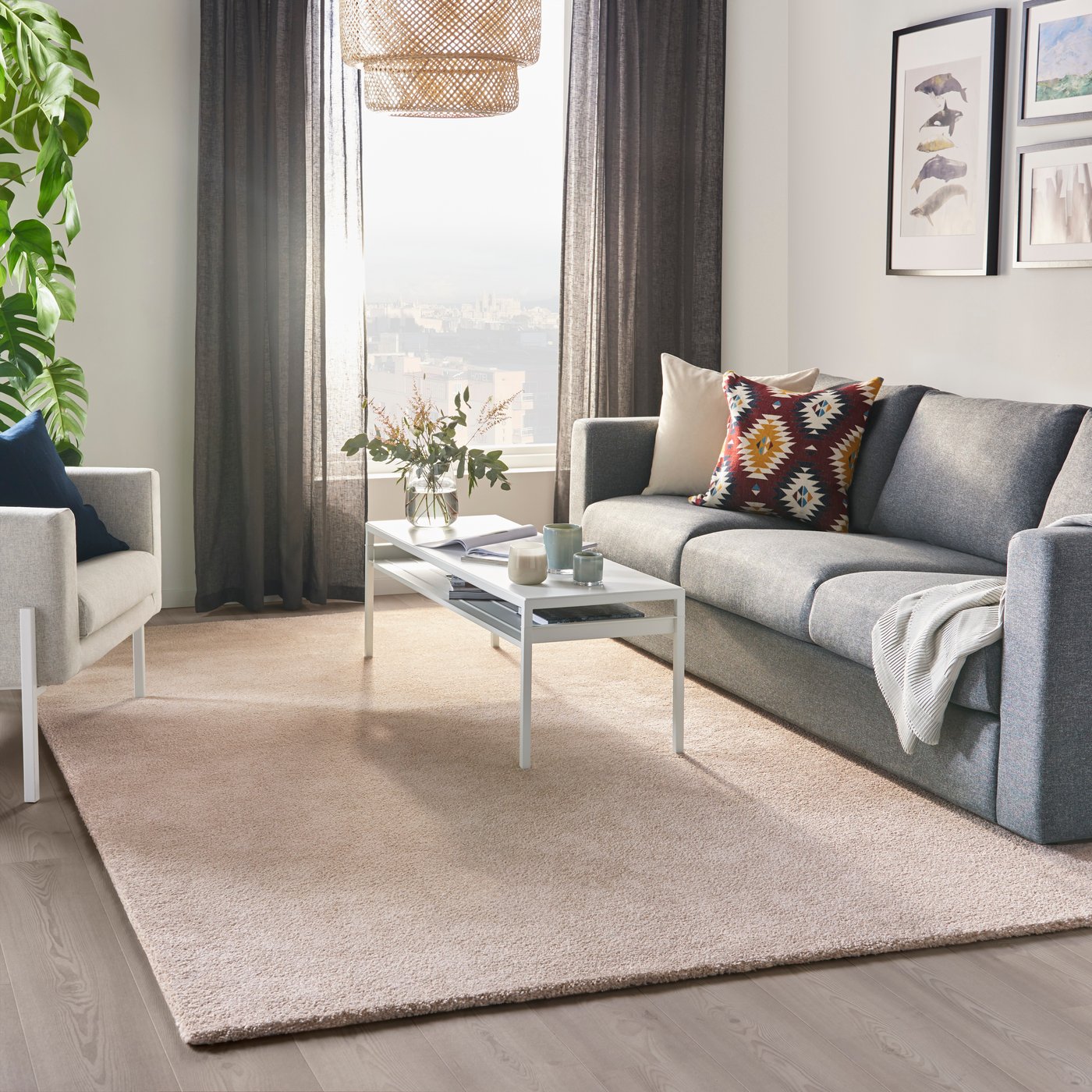 An off-white STOENSE rug, low pile