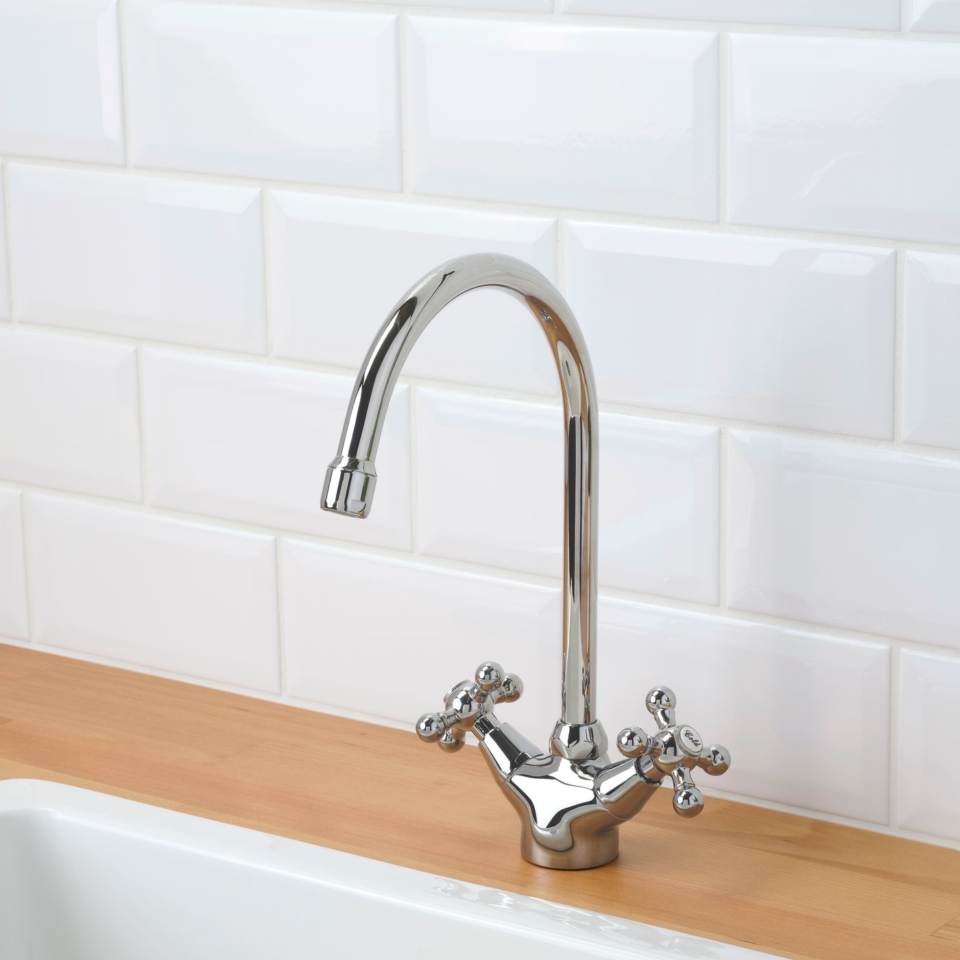 A chrome-plated EDSVIK dual-control kitchen mixer tap in the NA