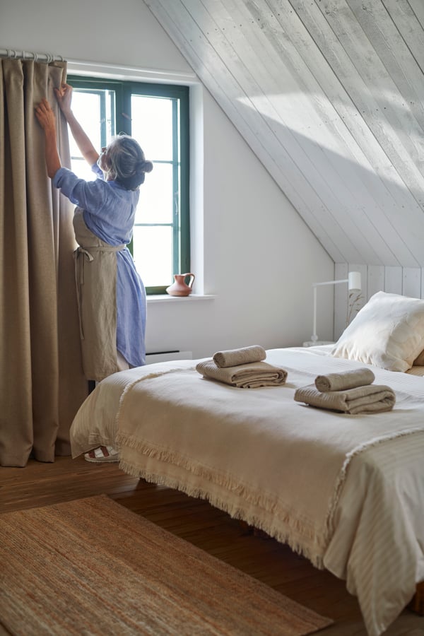 A light beige NATTJASMIN duvet cover and 2 pillowcases