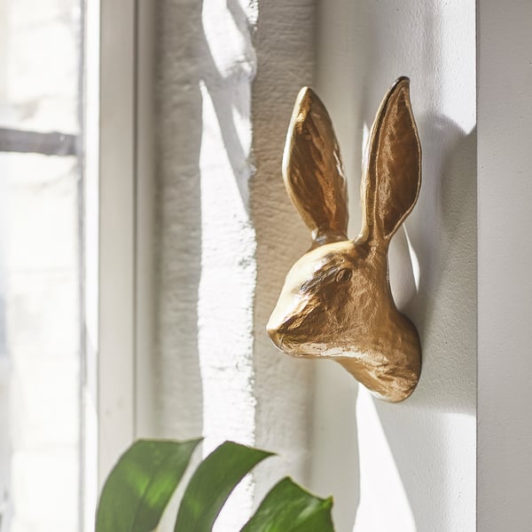 A rabbit/brass-colour HÄGGMISPEL wall decoration