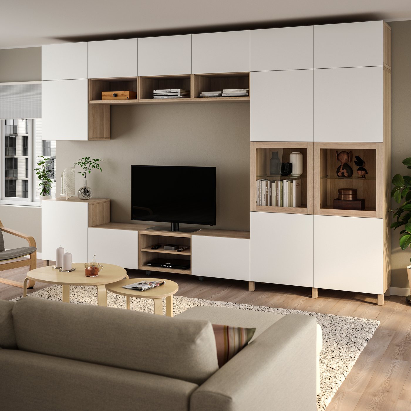 A white stained oak veneer Lappviken/Sindvik clear glass BESTÅ TV storage combination/glass doors in the living room.