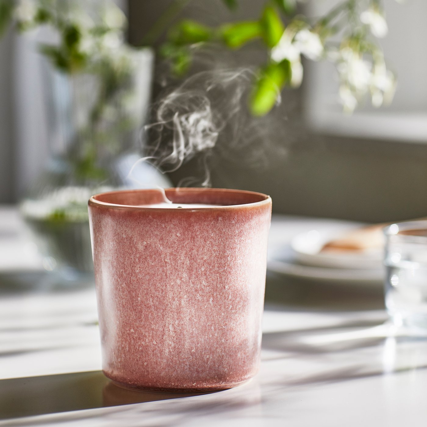 A Jasmine/pink LUGNARE scented candle in ceramic jar