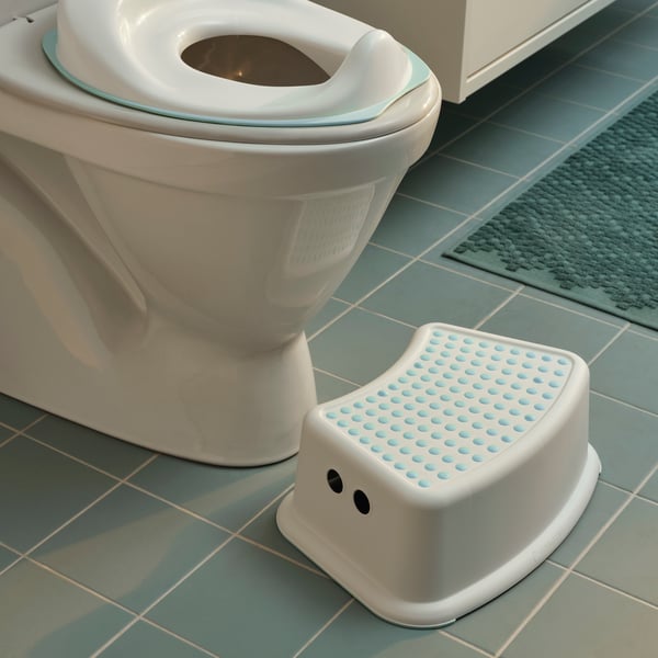 A white/turquoise FÖRSIKTIG children's stool