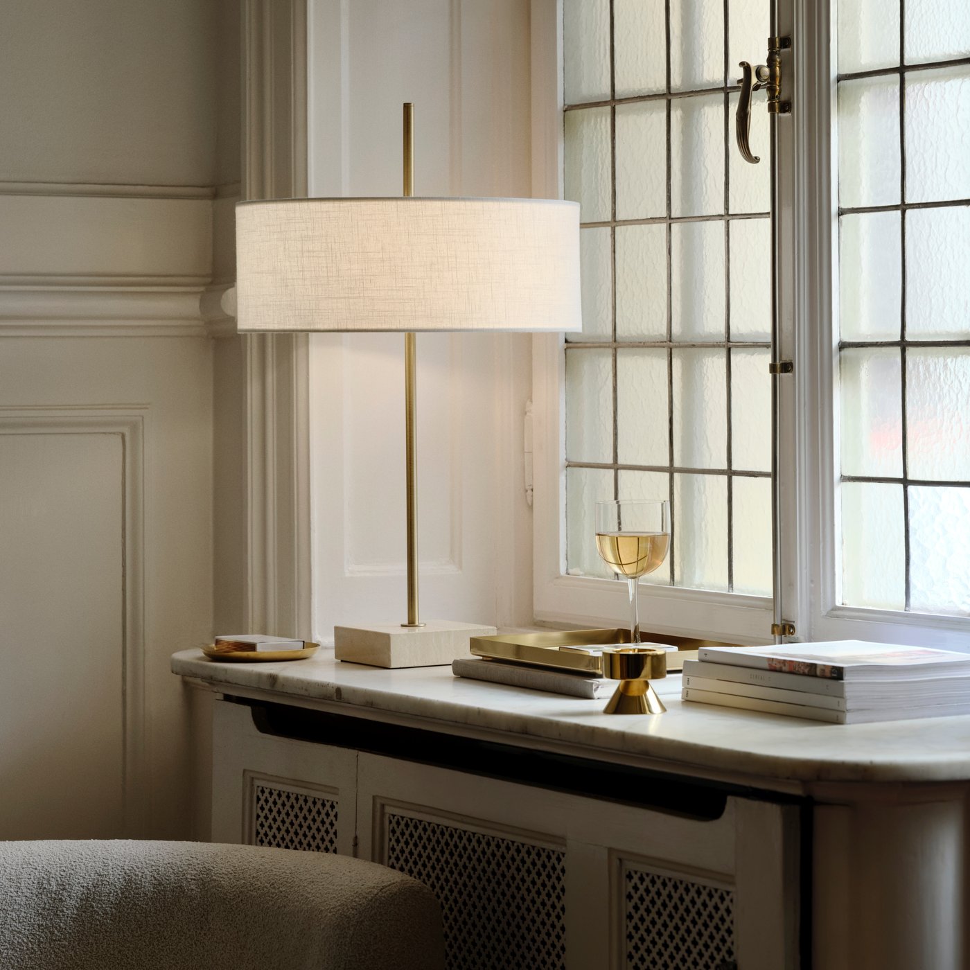 A brass-colour STOCKHOLM 2025 candlestick/tealight holder