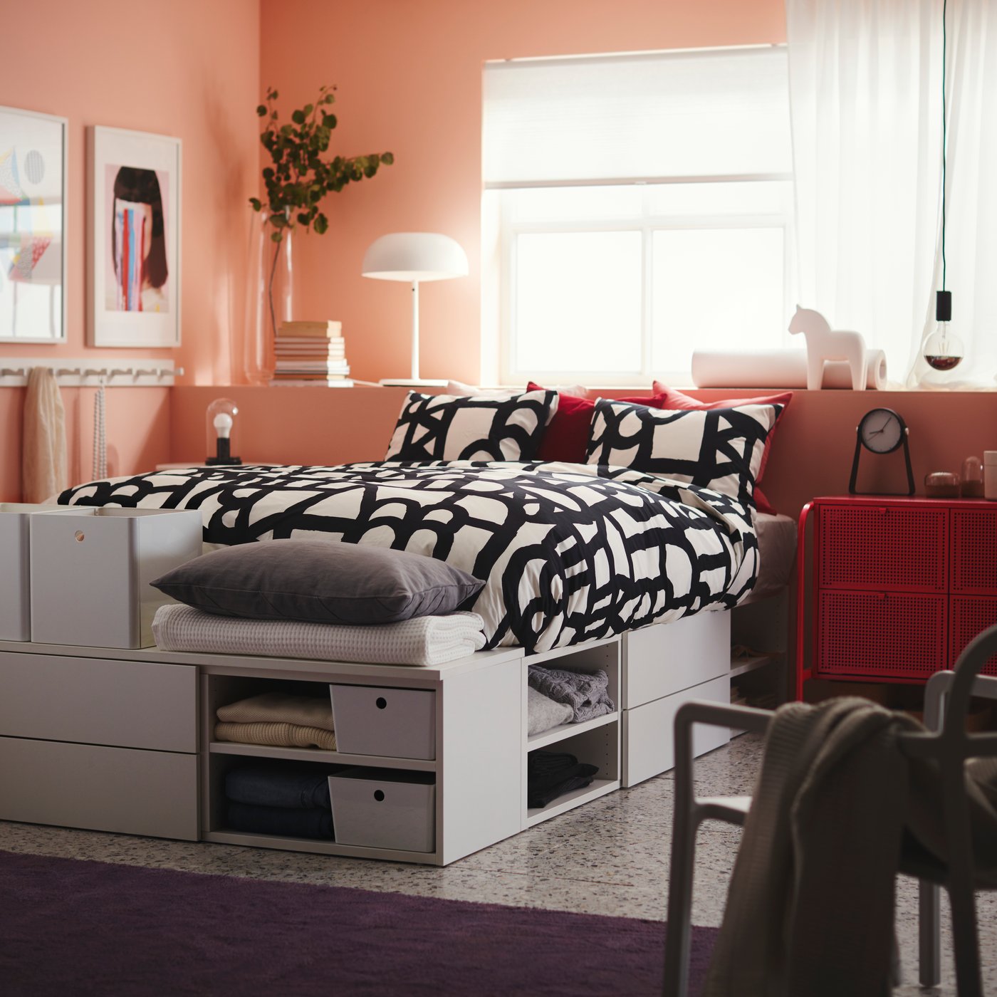 A white/Fonnes PLATSA bed frame with 4 drawers