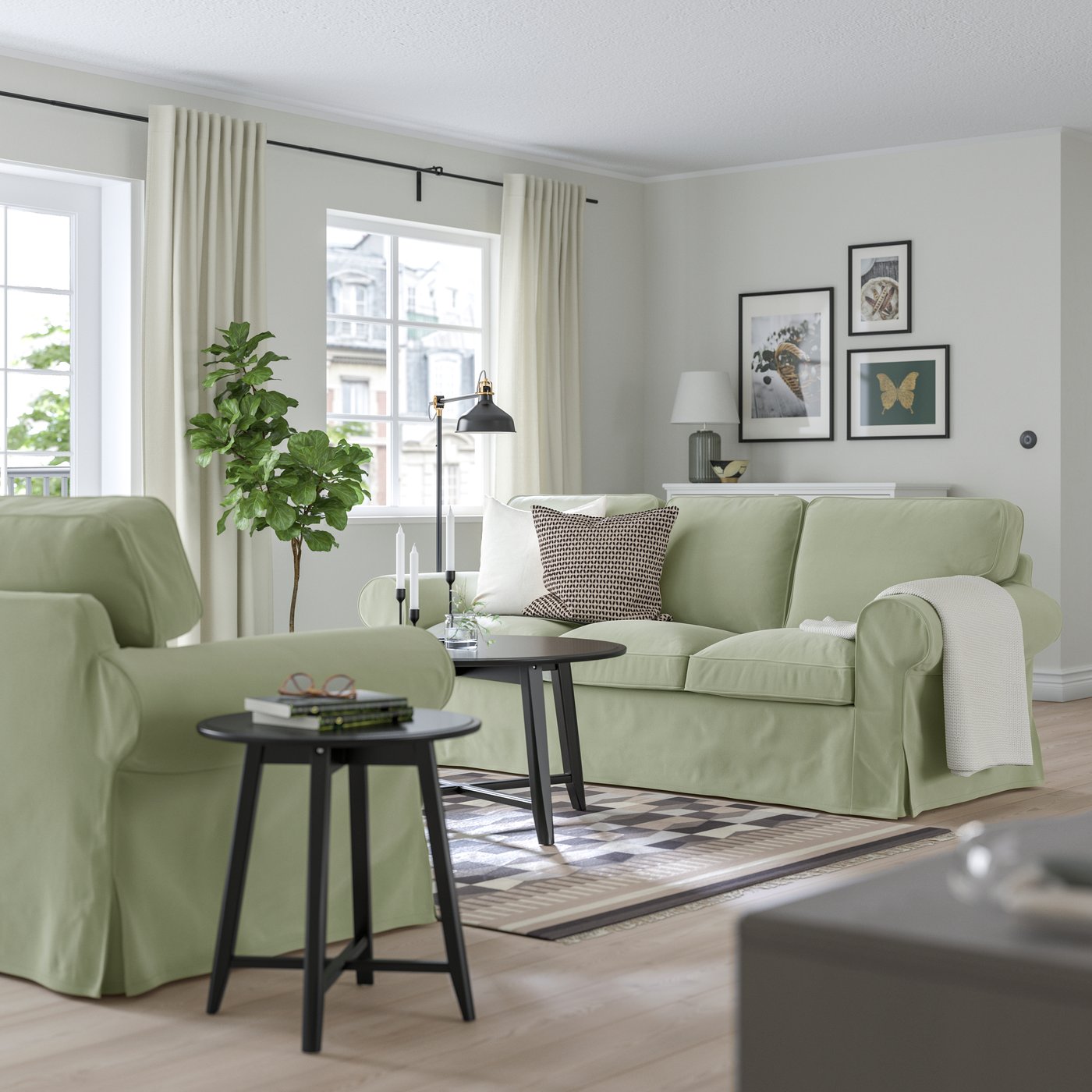 A Hakebo grey-green EKTORP 3-seat sofa in the living room