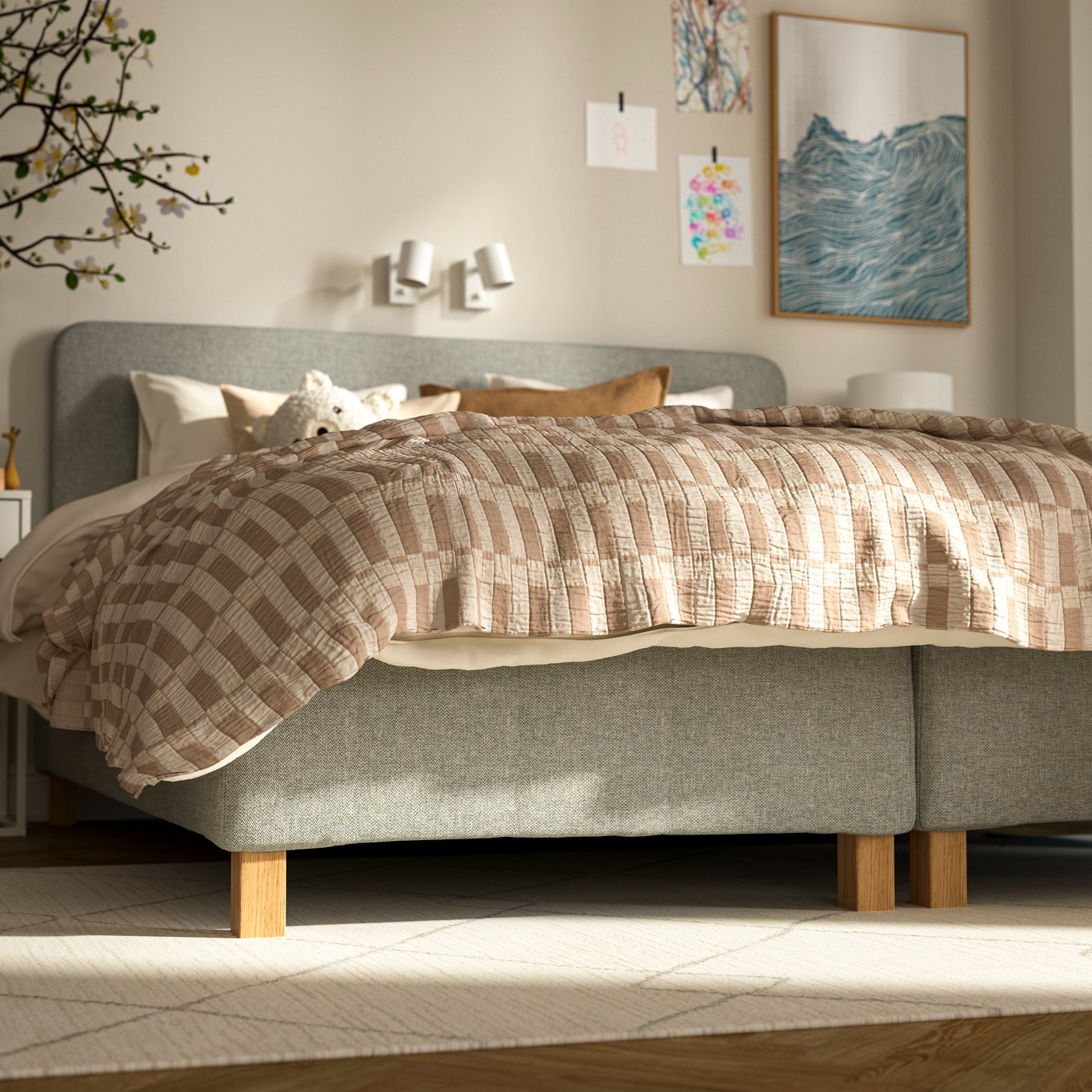 Two pocket spring mattress bases with 12.5 cm BURFJORD legs and a SKOGSKOVALL bedspread stand on a TVERSTED rug.