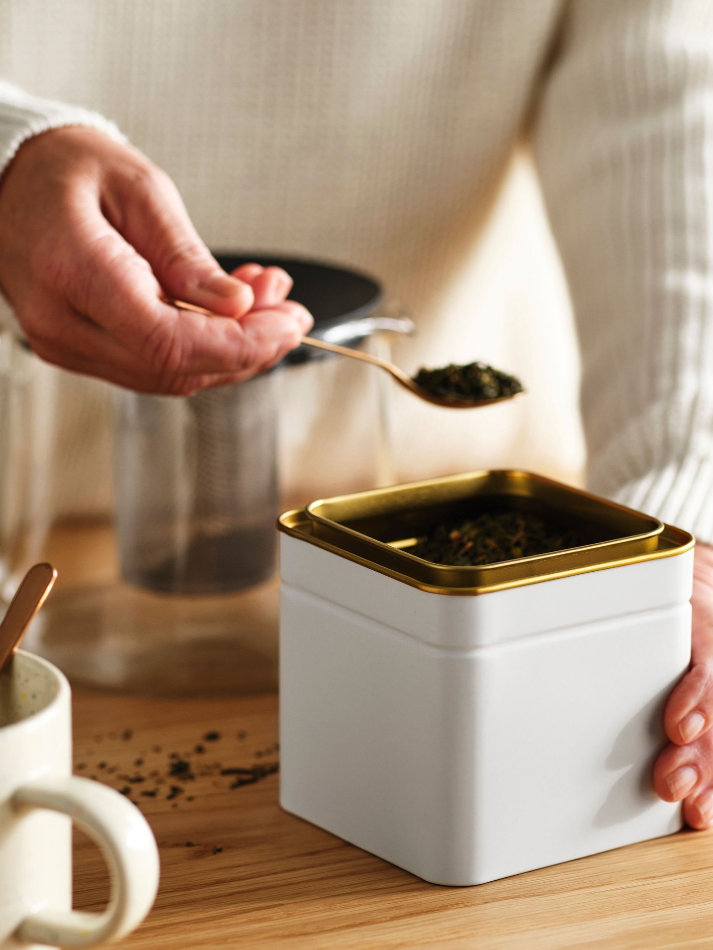 An off-white for coffee/tea BLOMNING tin with lid in the NA