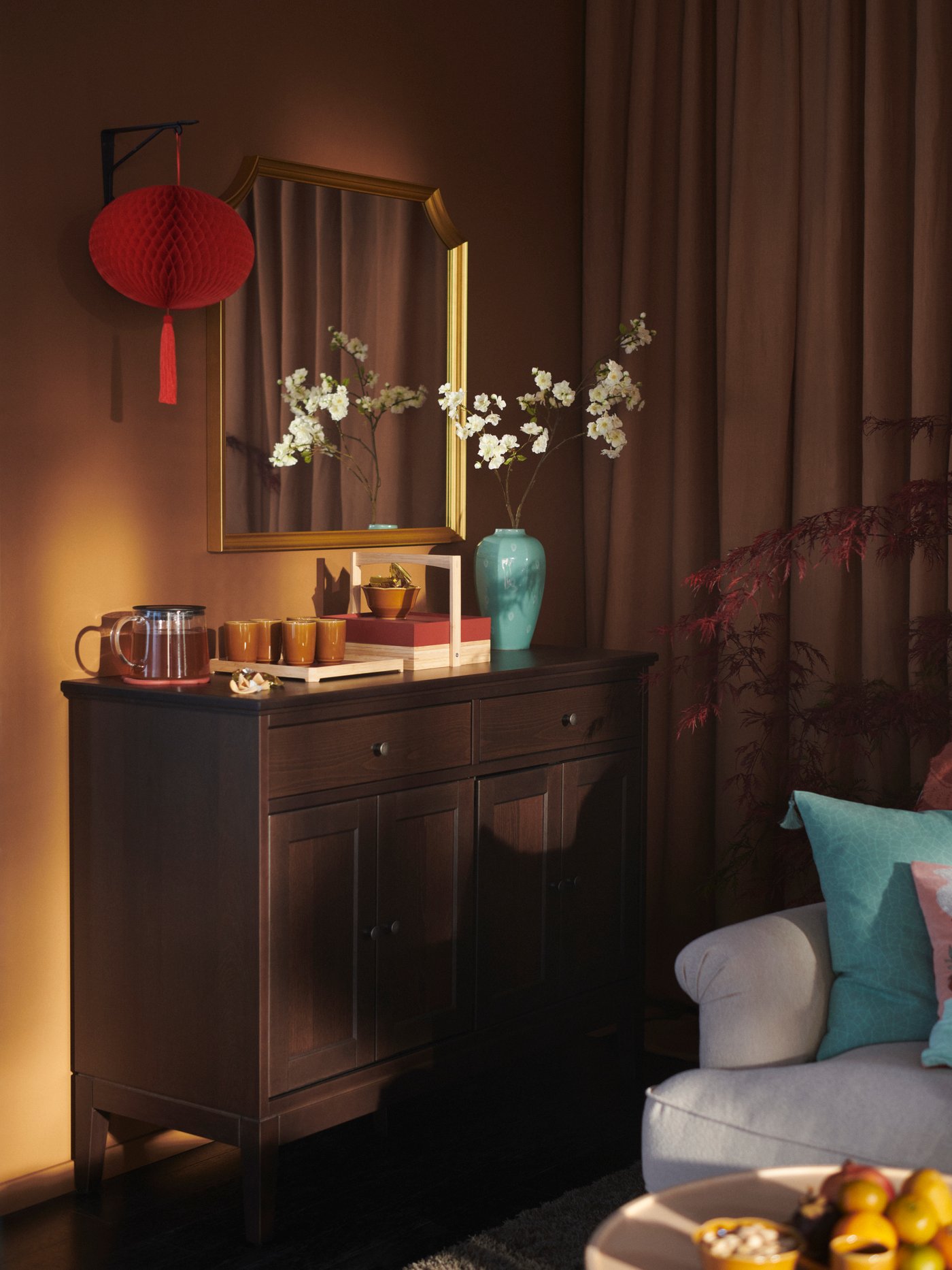 A cherry-blossoms/pink SMYCKA artificial flower in the living room