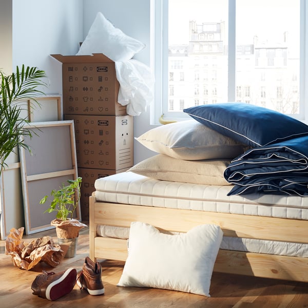 A pine UTÅKER stackable bed in the bedroom