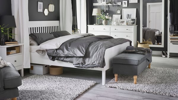 A white IDANÄS bed frame in the bedroom