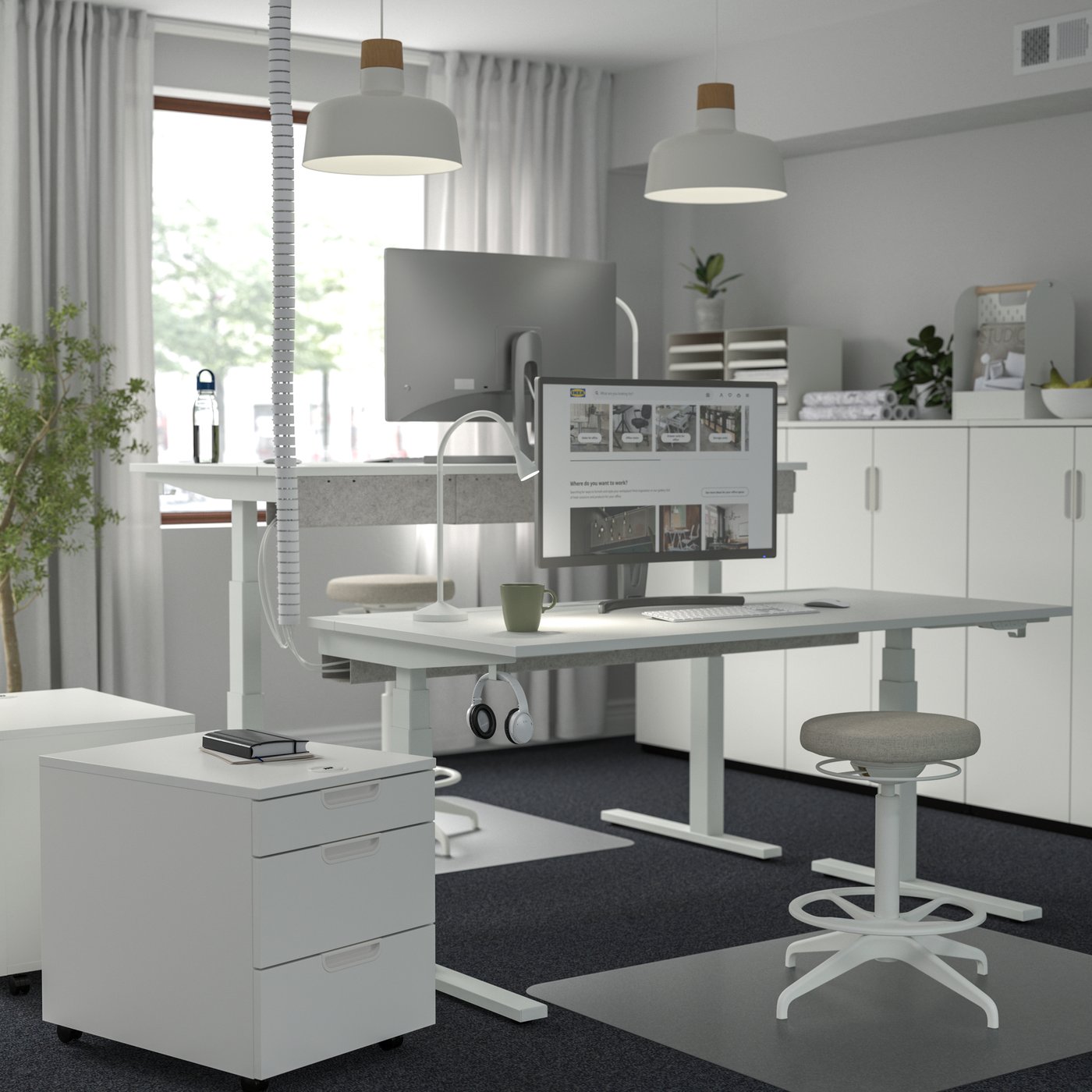 An electric white MITTZON desk sit/stand