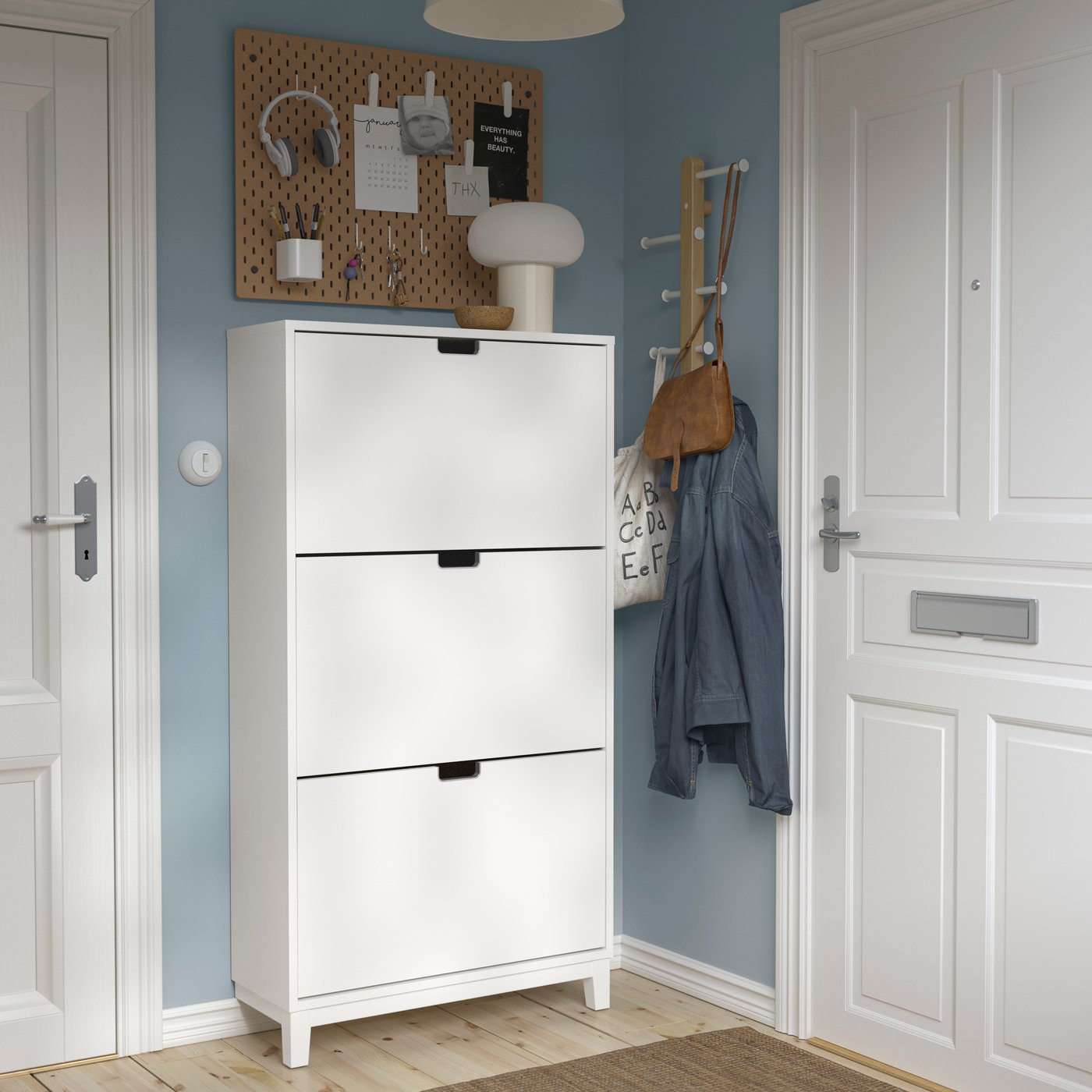 A white STÄLL shoe cabinet with 3 compartments