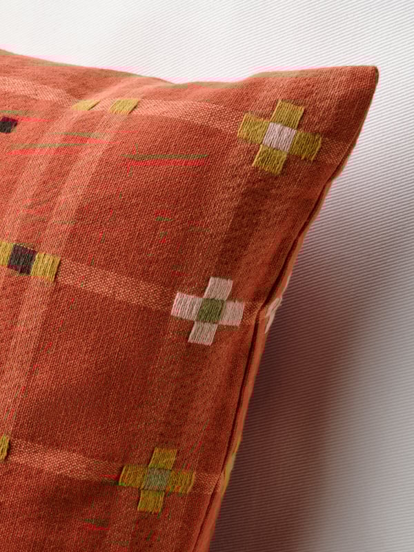 A red KUSTGRAN cushion cover