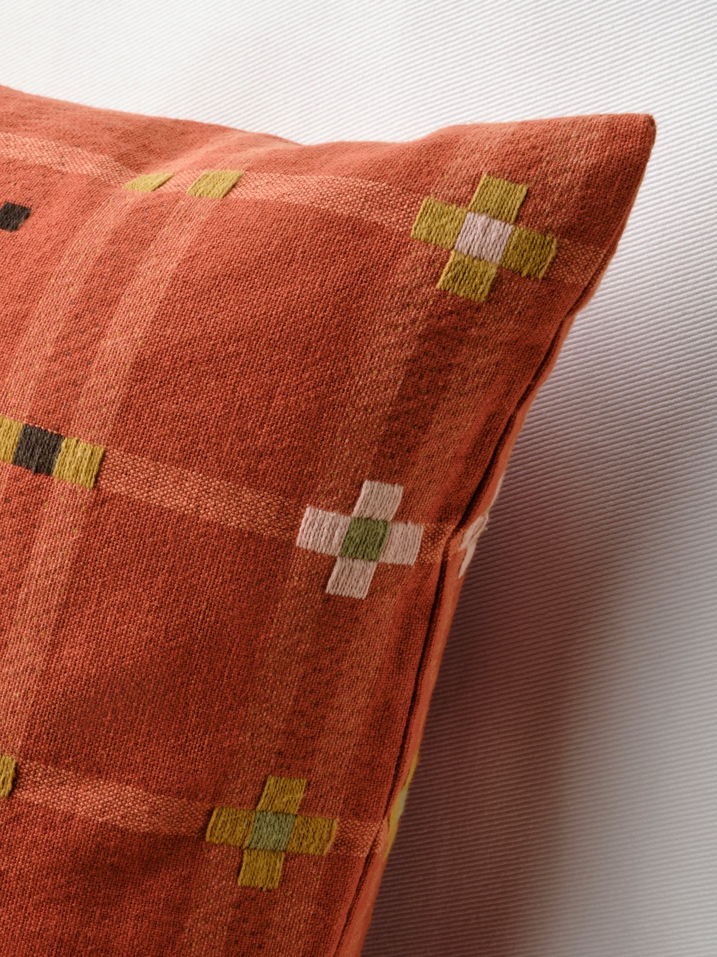 A red KUSTGRAN cushion cover