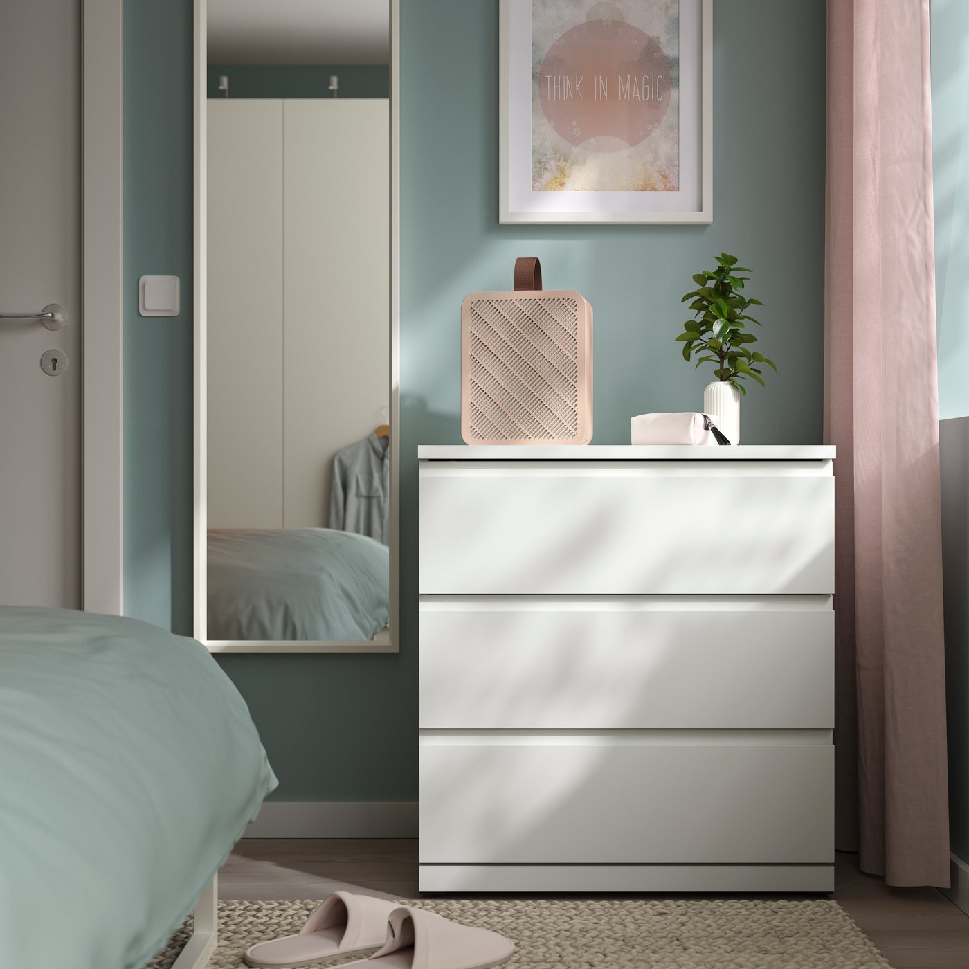 UPPÅTVIND air purifier on a cabinet, with a framed picture in the background.