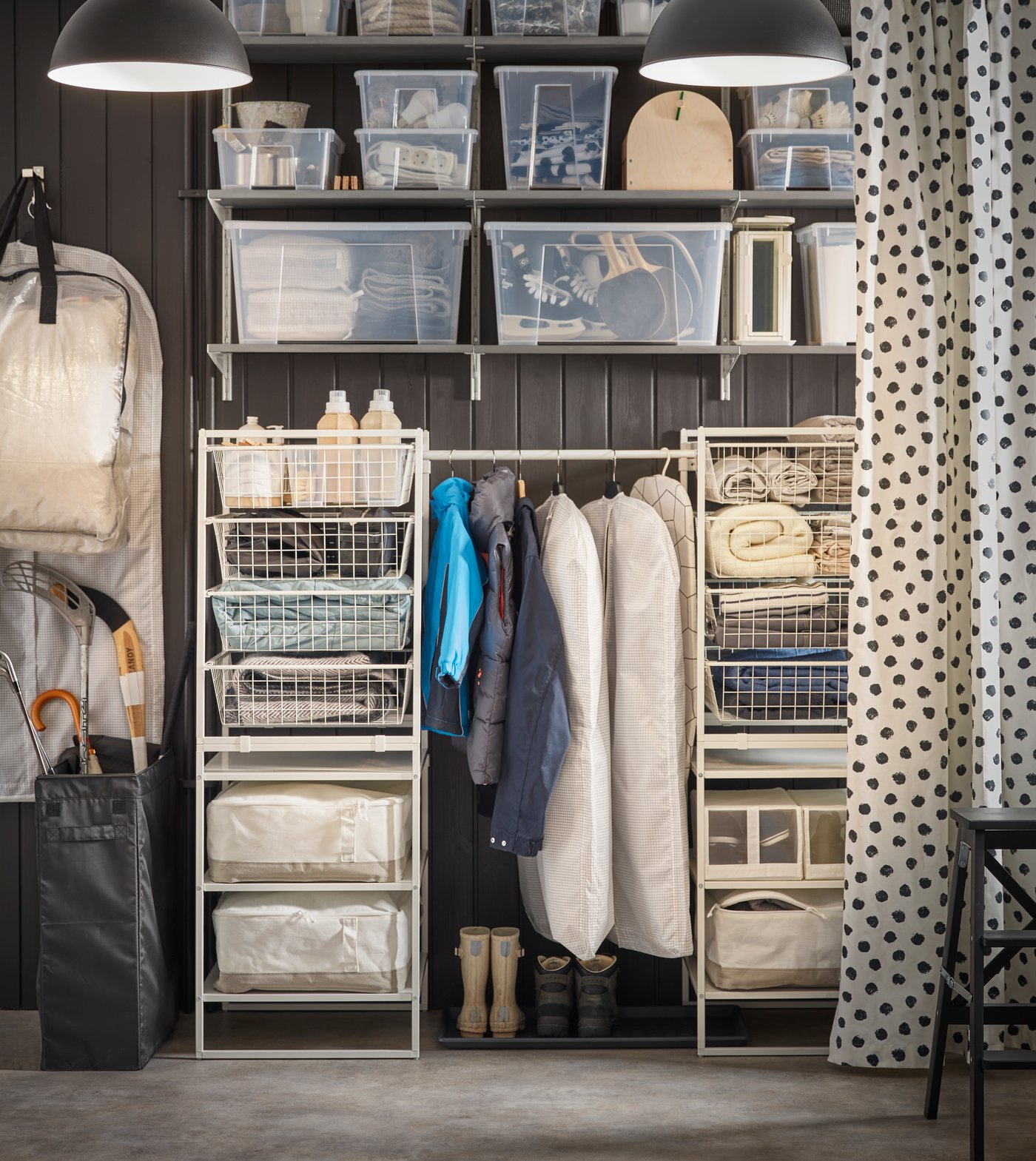 A BOAXEL storage system filled with drawer units, wall shelves, and a hanging section.
