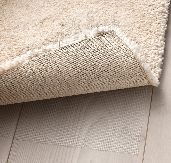 An off-white STOENSE rug, low pile