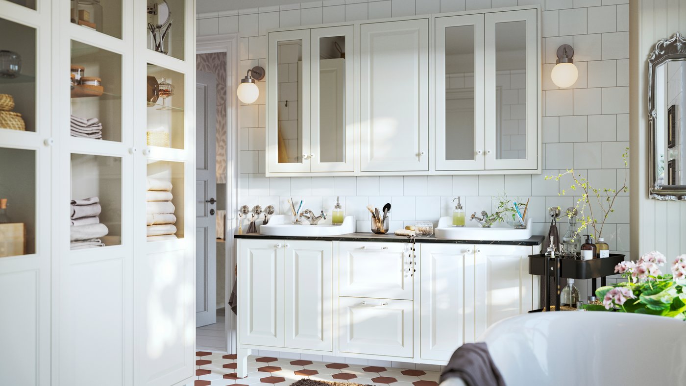 A bathroom featuring white TÄNNFORSEN vanity with doors and drawers, mirror cabinets with doors and three high cabinets.