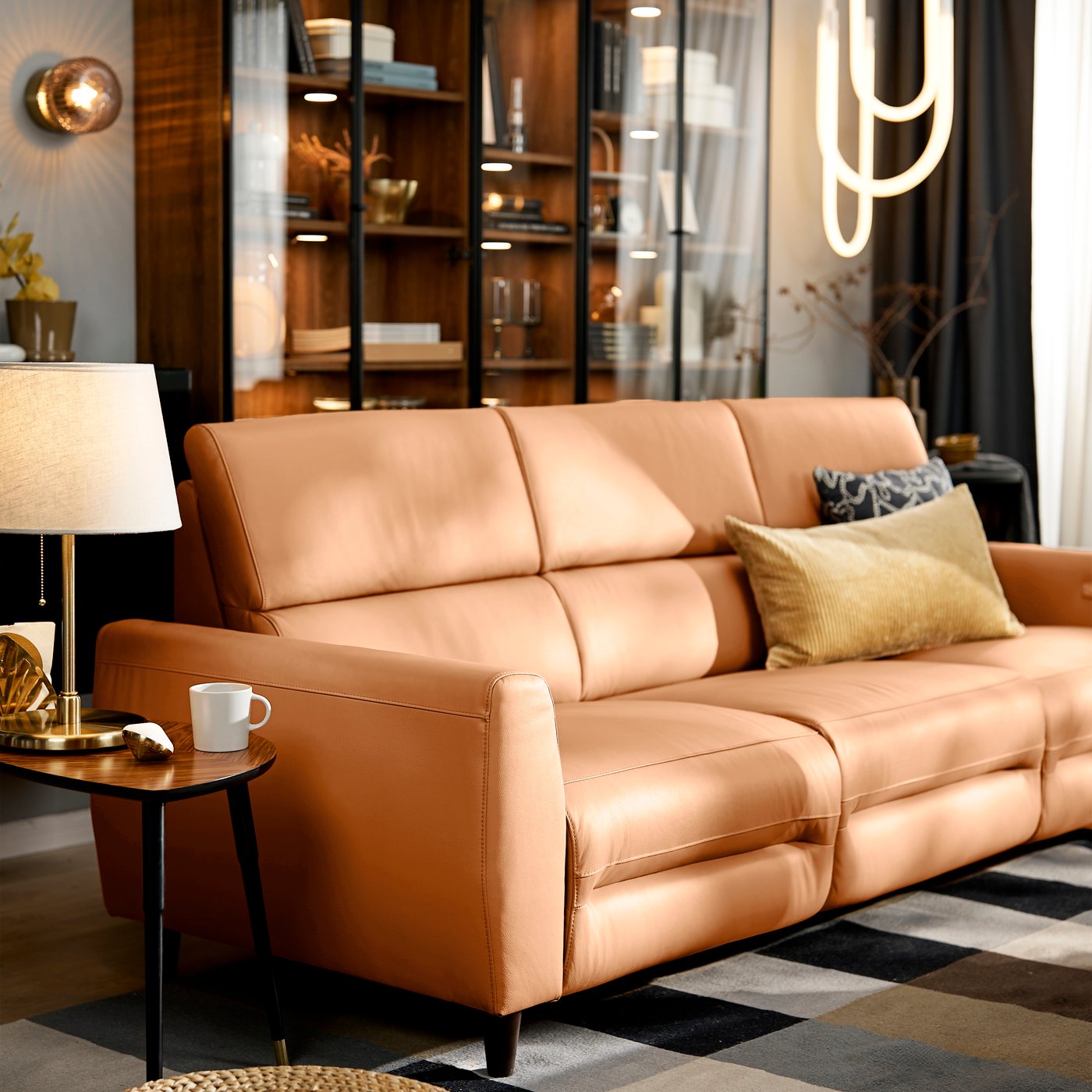 A Grann/Bomstad golden-brown RULLERUM 2-seat sofa with electric recliner