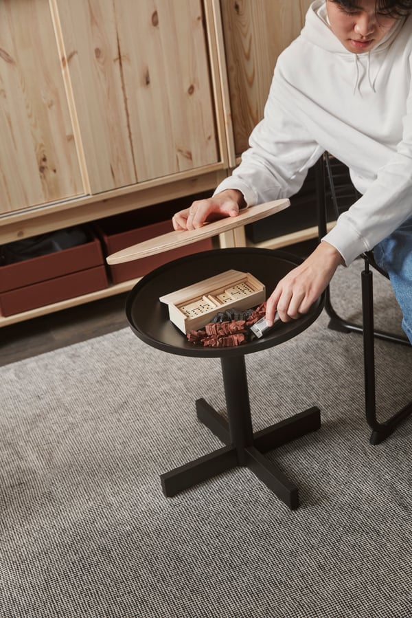 A pine plywood/black GRIMSARBO side table