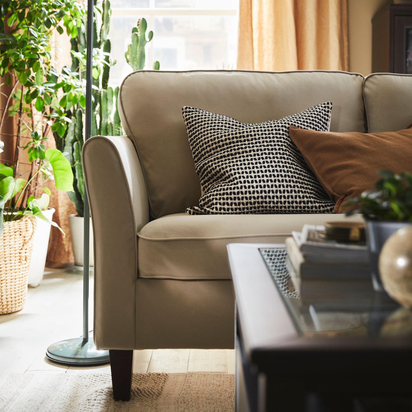 A dark brown stained IDANÄS coffee table in the NA