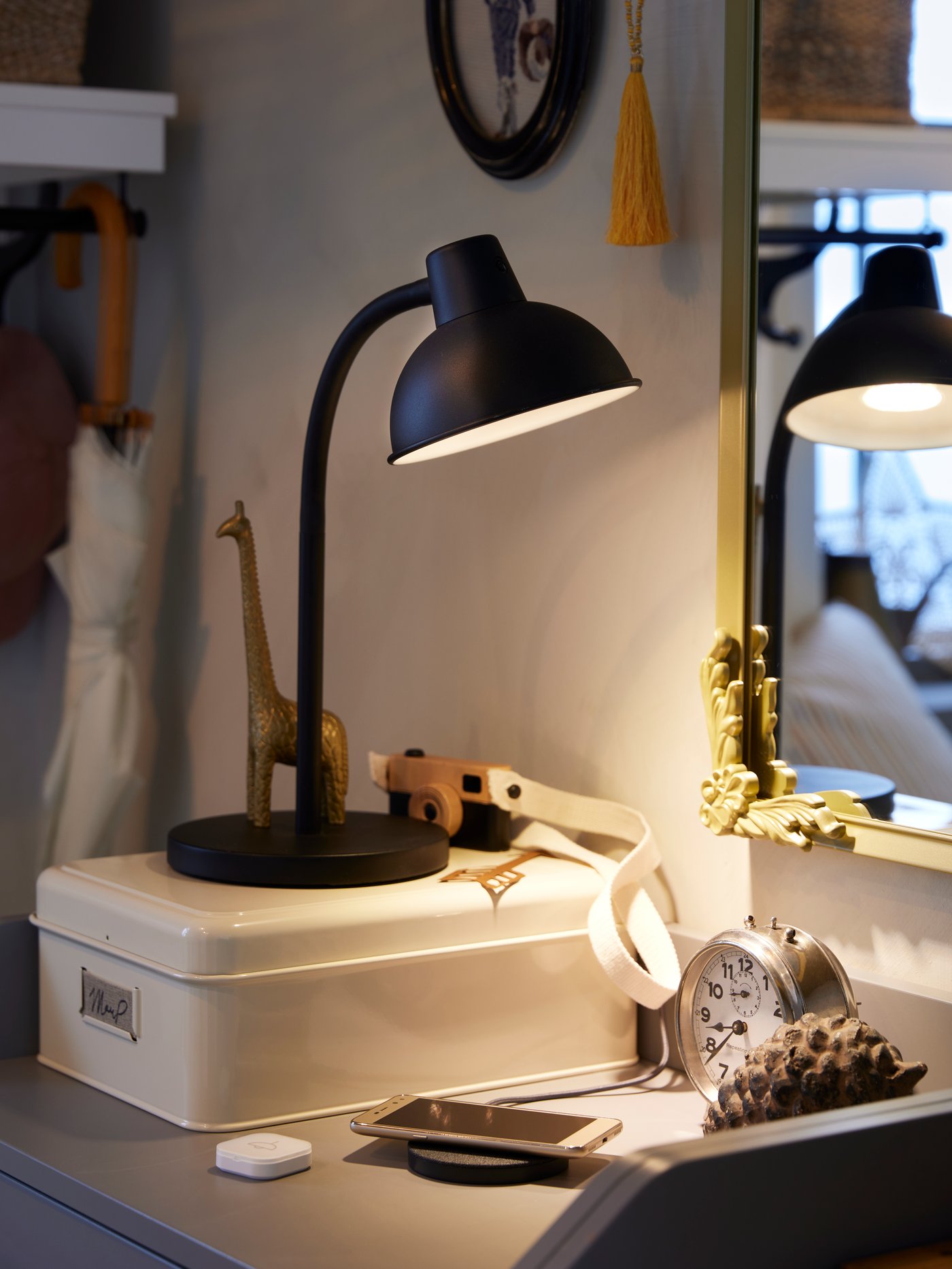 A light beige PLOGFÅRA storage box with lid