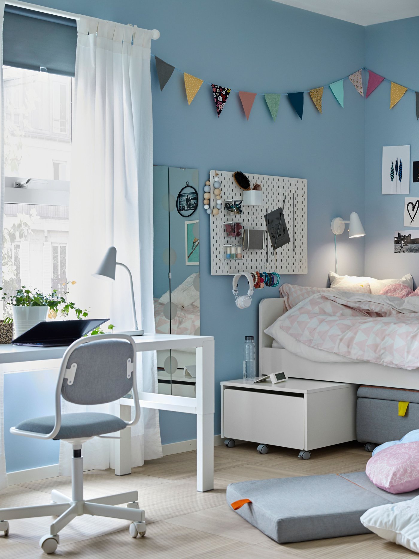 A white SLÄKT bed frame