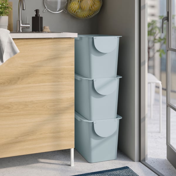 A light grey-blue TRÖSKNING bin with lid