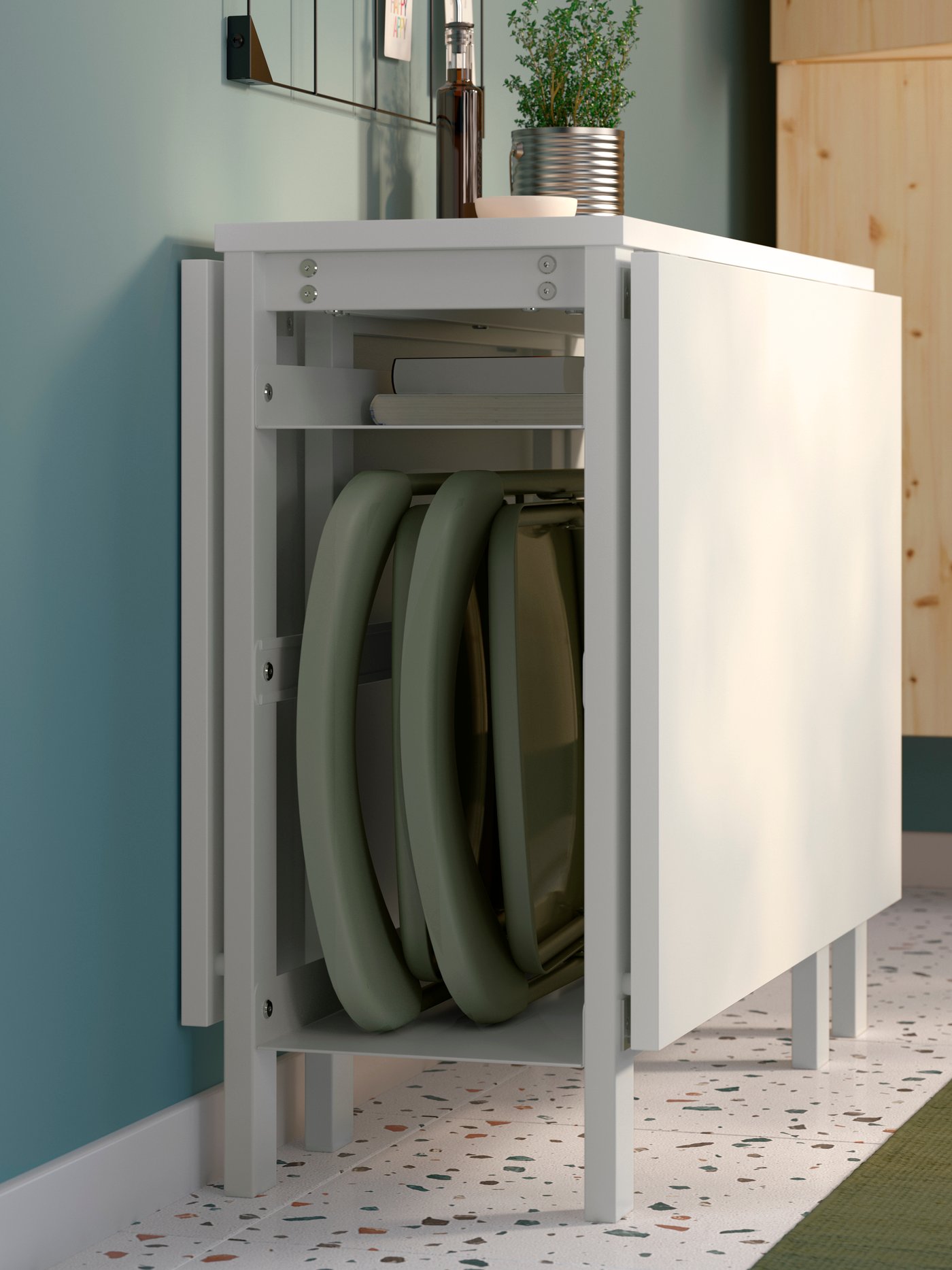 A green VIHALS folding chair