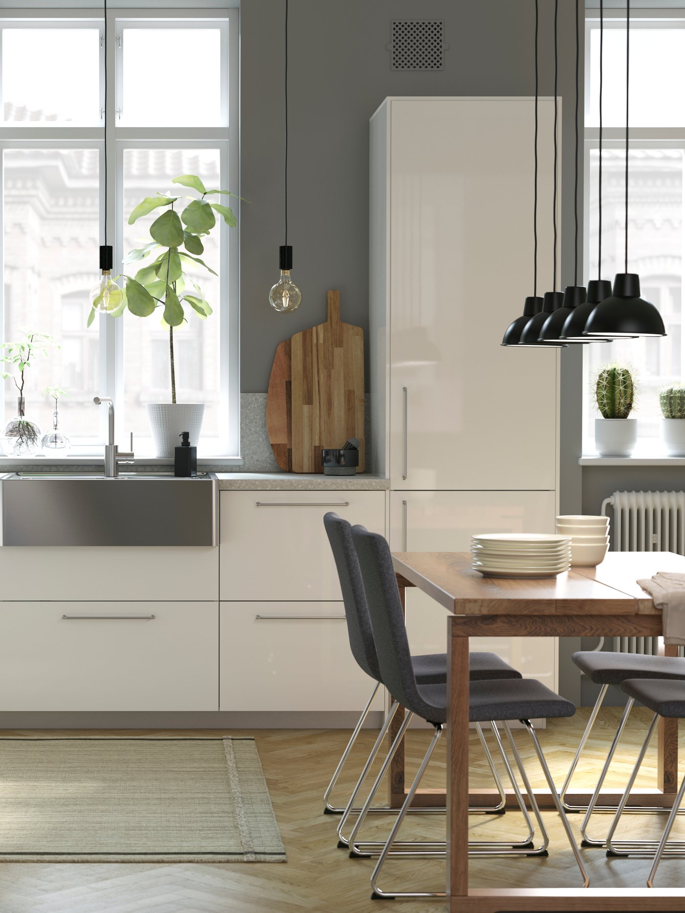 Moderne Küche mit weißen Hochglanzfronten, Edelstahl Spüle und grauen Wänden.