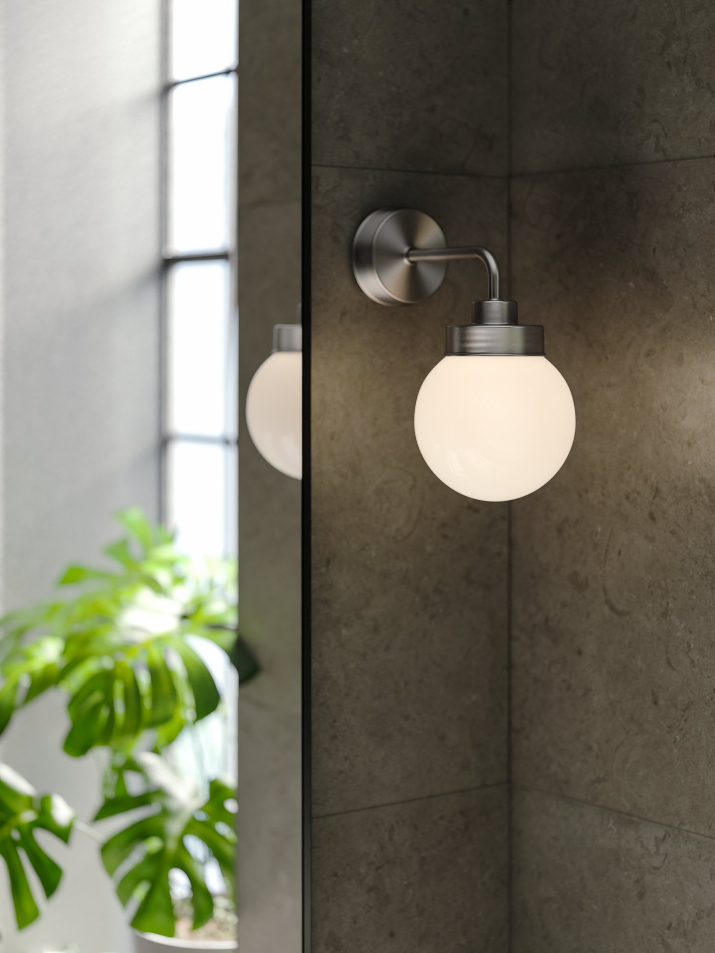 A black LINDBYN mirror in the bathroom