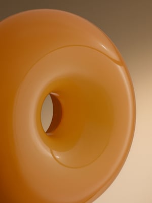 An orange glass/round VARMBLIXT LED table/wall lamp