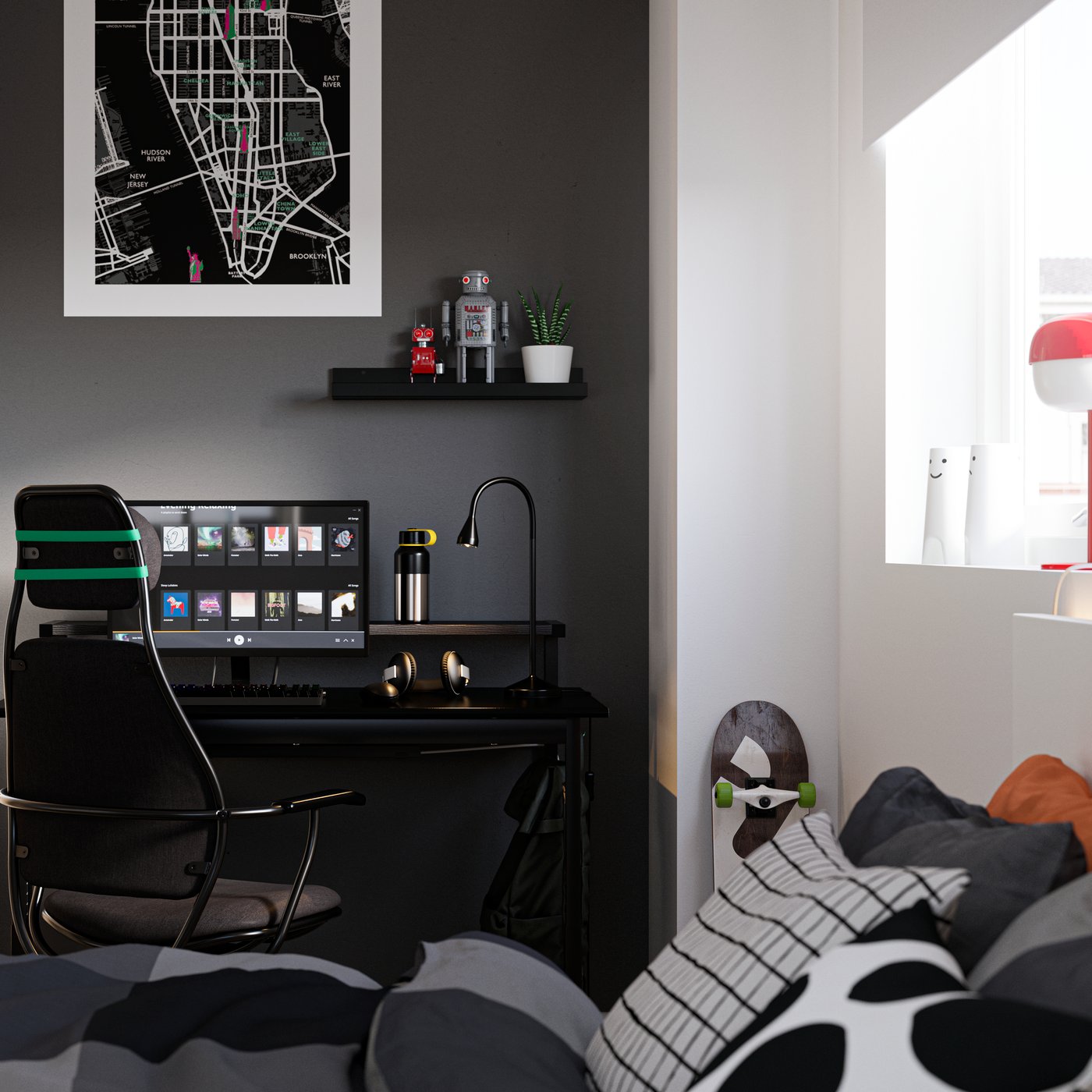 Bedroom with a bed in the foreground and a desk by a wall painted black in the back, with a computer and gaming chair.