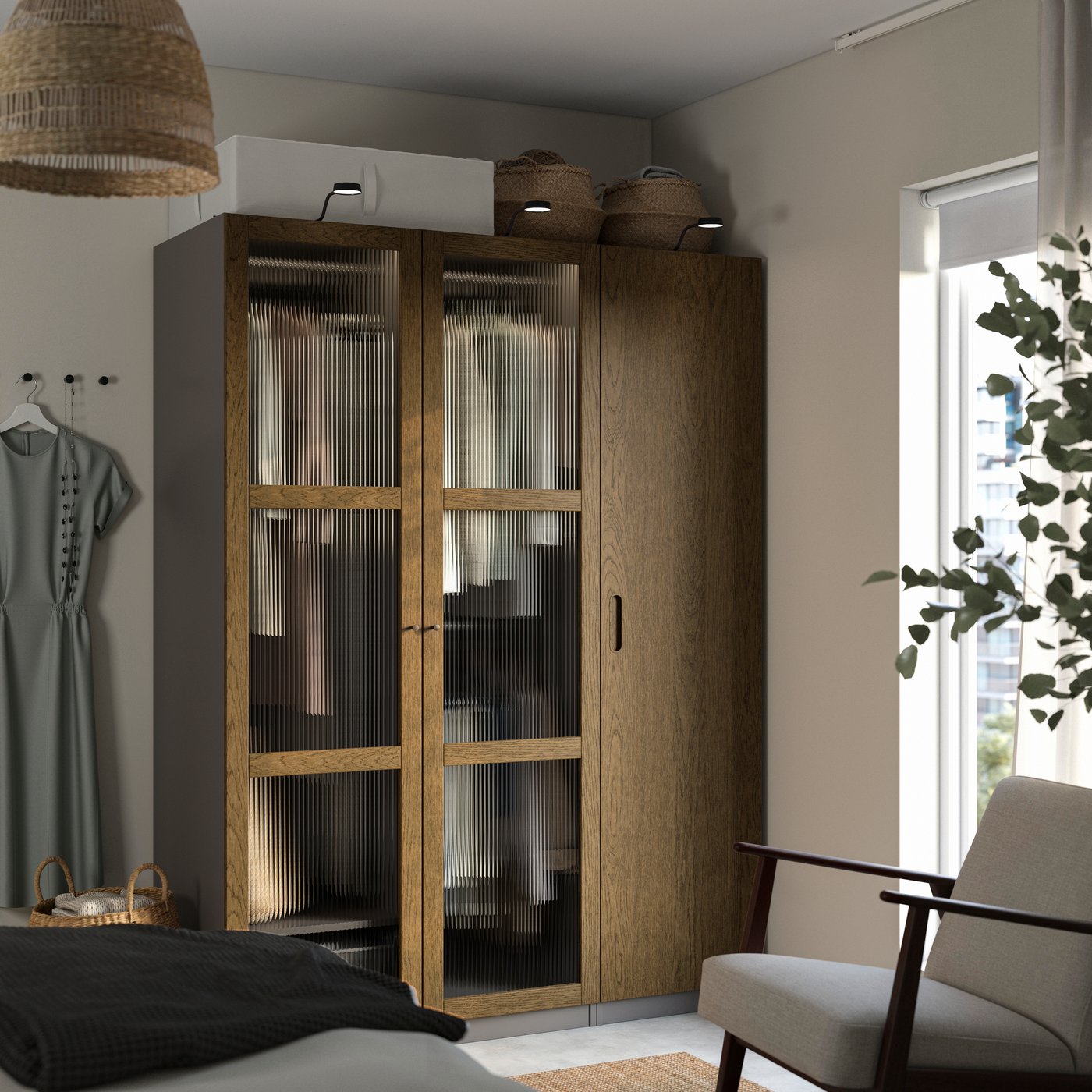 A dark grey brown/stained oak veneer glass PAX wardrobe combination