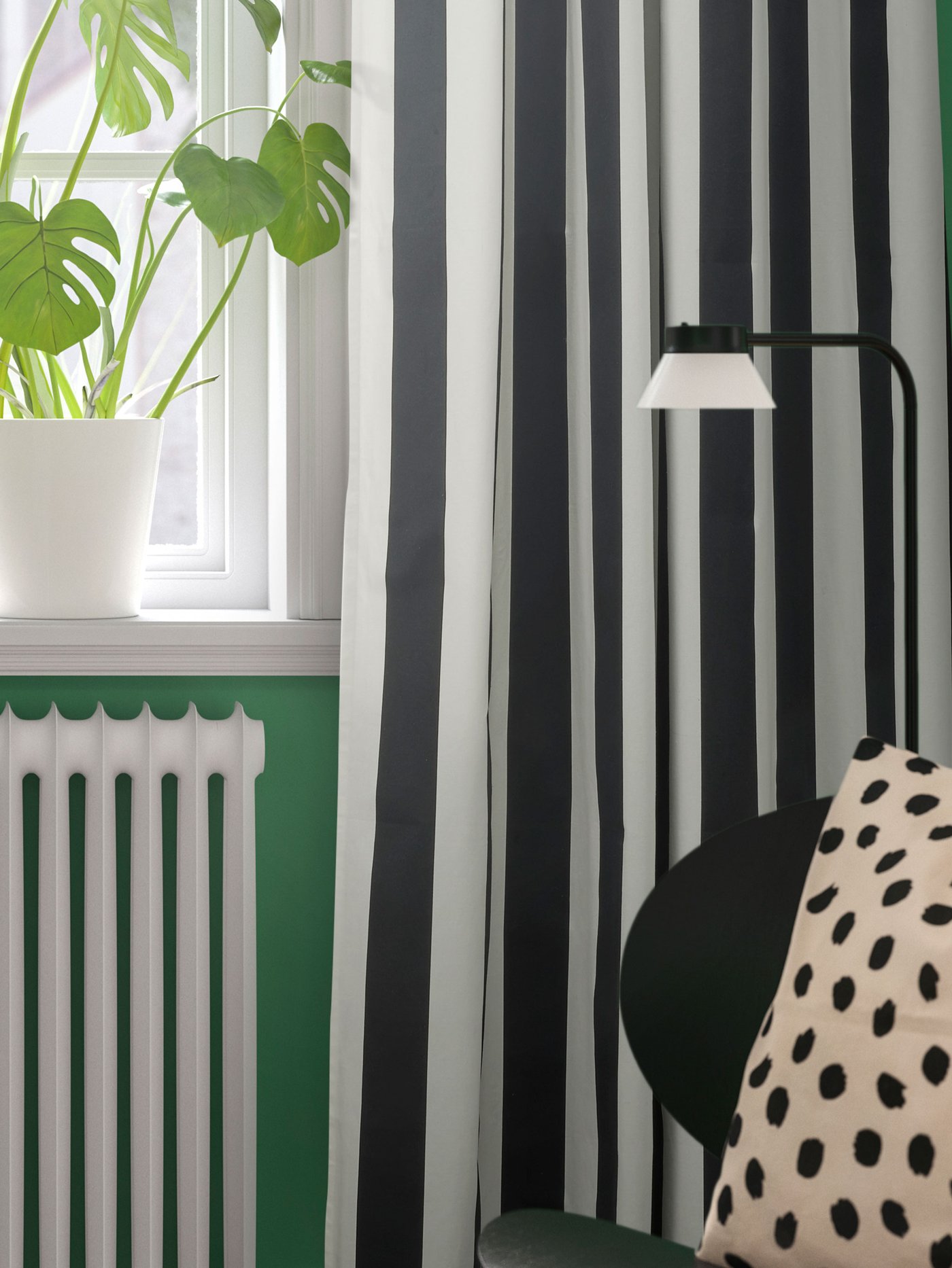 An off-white/dot pattern black ODDNY cushion cover