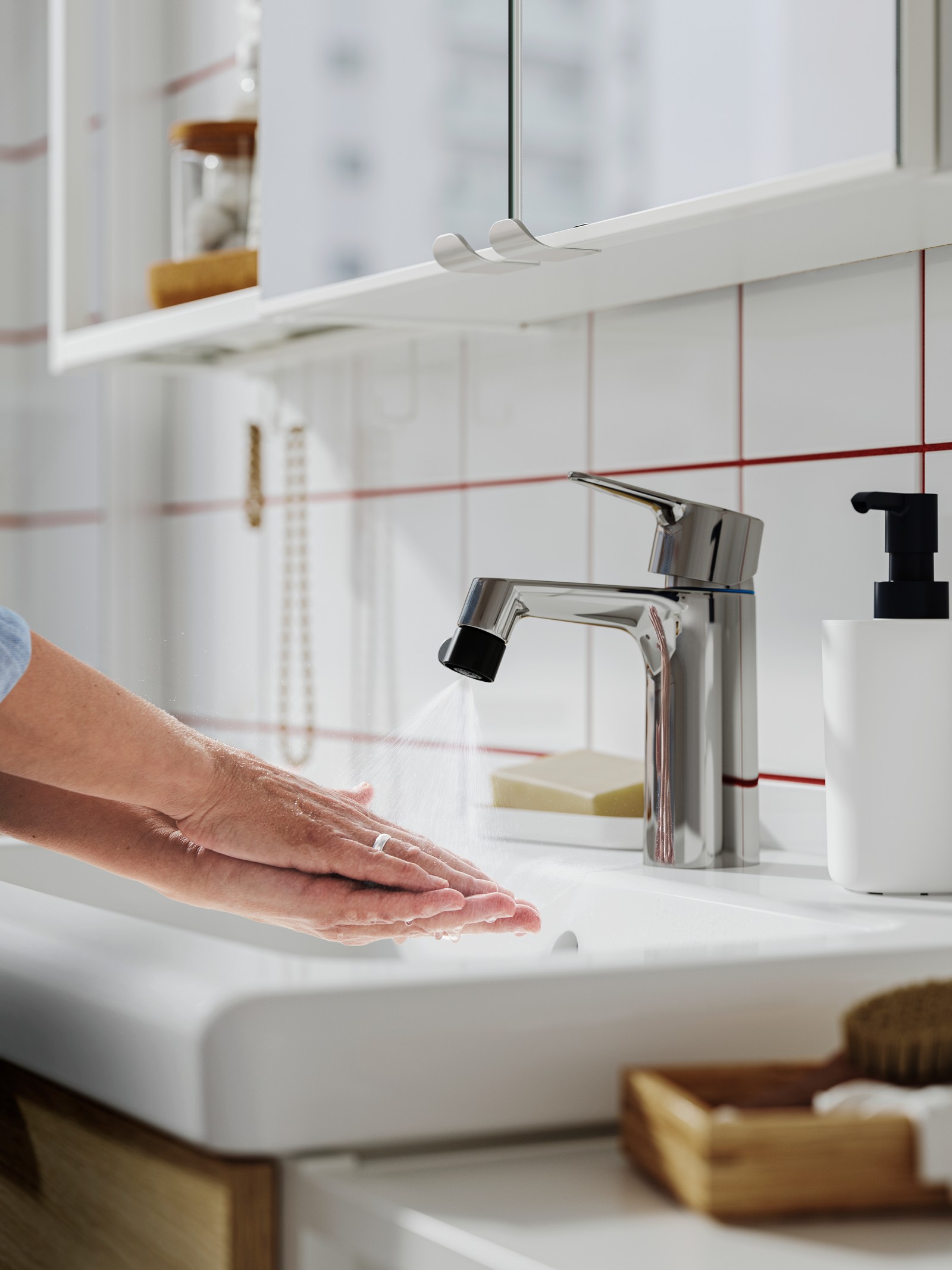 An ÅBÄCKEN mist nozzle for mixer tap in the bathroom