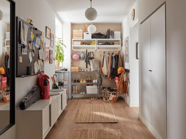 A hallway with a LOHALS jute rug
