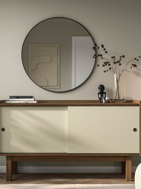 A dark beige wood/light beige FÖRSÄLJARE sideboard